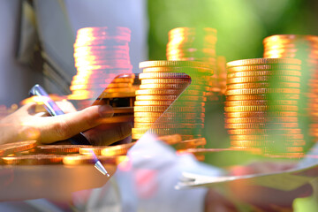 Double exposure, business working a smartphone and golden coins on table background and Business growth strategy of money concept