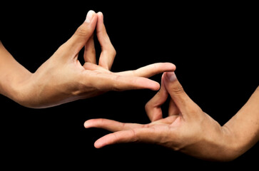 Wall Mural - Pair of Hands Showing mudra sign, mudra yoga isolatedd in black, high quality image.