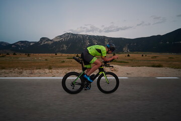 Wall Mural - triathlon athlete riding bike