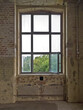 © Mellimage/Stocksy - open window in an old decaying hall