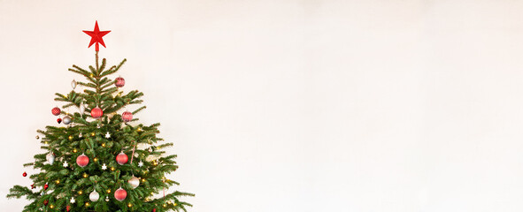christmas tree with christmas ball decoration and ornamen like star. white isolated background with 