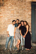 © HEX./Stocksy - Group of Friends Street Night Shot