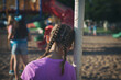 © Sean Locke Photography/Stocksy - Recess: Lonely Girl Leans Against Swingset Watching Others