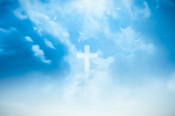 christian cross appears bright in the sky background and soft clouds. with the light shining as love