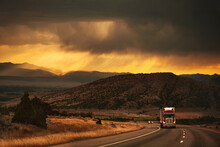Semi-truck Driving In Beautiful Mountain Scene