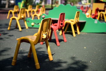 Empty chairs inside a kinder garden play zone, maintaining social distance as a measure during the COVID 19 pandemic