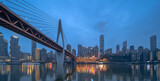 Fototapeta Nowy Jork - Night view of the Qiansimen bridge and the skyline in Chongqing, China.