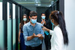 © godji10 - Selective Focus. Company employees use sanitizer alcohol washing hands to colleagues before working at the workplace on a business day that covid-19 coronavirus epidemics.