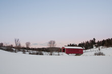 Rural Red Covered Bridge In The Snow.