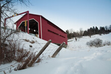 Rural Red Covered Bridge In The Snow.