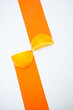 © Audrey Shtecinjo/Stocksy - Composition of two pieces of orange on white background