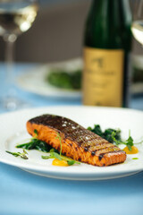 Wall Mural - Grilled salmon fillet steak on the blue table