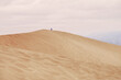 © Per Swantesson/Stocksy - Man sitting on top of sand dune in Death Valley, meditating
