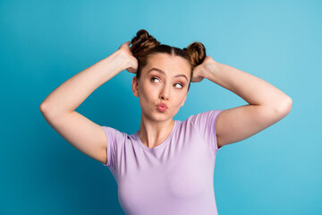 Poster - Photo of attractive teen lady touch check nice hairstyle two funny pretty buns hairdo like new style look flirty empty space send kisses wear casual t-shirt isolated blue color background