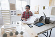 © Tetra Images - Architect working in office