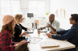 © Tetra Images - Friends having business meeting in office