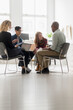 © Tetra Images - Friends having business meeting in office
