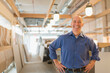 © Tetra Images - Portrait of smiling business owner