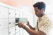 © Tetra Images - Man checking mailbox