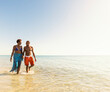 © Tetra Images - Mature couple walking in sea