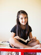 © Jessica Peterson/Tetra Images - Girl (8-9) reading book