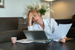 © Tetra Images - Portrait of overworked woman using computer