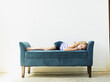 © Jessica Peterson/Tetra Images - Girl (4-5) sleeping on bench indoors