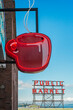 © Bryan Mullennix/Tetra Images - Neon coffee cup in front of cafe, low angle view