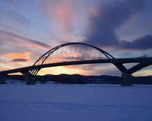 Lake Champlain Bridge Linking New York And Vermont Over A Frozen Lake Champlain At Crown Point, Snowed Landscape At Dusk
