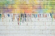 © Nemanja Glumac/Stocksy - Raining Colours on a White Brick Wall