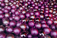 Pile Of Purple Christmas Ornaments