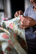 © Cara Dolan/Stocksy - Woman sews a quilt by hand