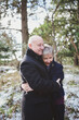 © Rob and Julia Campbell/Stocksy - Happy older middle aged couple (fifties) holding or hugging each other outside in winter