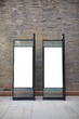 © Bo Bo/Stocksy - empty advertisement box in street