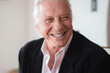 © Per Swantesson/Stocksy - Successful, handsome smiling man in his 60s