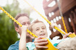 © Sean Locke Photography/Stocksy - Father: Boy Excited to Be Pushed on Swing