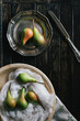 © Marija Savic/Stocksy - Pears on Dark Wooden Table