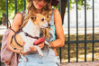 © Lumina/Stocksy - Blonde Woman Holding Her Dog