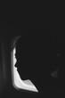 © Jovana Rikalo/Stocksy - Portrait of a young woman looking through an airplane window