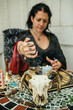 © kkgas/Stocksy - Witch or Psychic casting a spell to predict the future