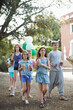 © MIQUEL LLONCH/Stocksy - Group of children preparing a party in a yard