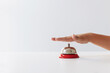© Kelly Knox/Stocksy - hand ringing a counter bell