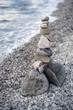 © ALICIA BOCK PHOTOGRAPHY/Stocksy - A Tall Stack Of Balancing Stones On A Rocky Beach