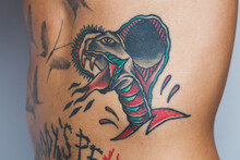 Cobra Snake Tattoo On The Torso Of A Young Man