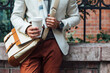 © Lumina/Stocksy - Man Holding a Paper Coffee Cup