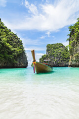 Wall Mural - Thai traditional wooden longtail boat and beautiful beach.