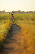 © Marcel/Stocksy - Bicycle parked on rural bikelane in The Netherlands