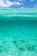 © Jovana Milanko/Stocksy - Emty half turquoise tropical sea water half blue sky background