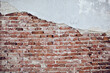 © AD Photography/Stocksy - Cracked cemented wall