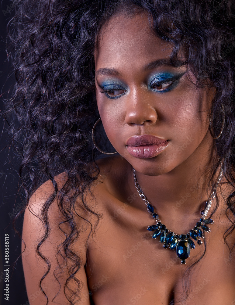Extreme close-up of beautiful young African model with curly big hair ...